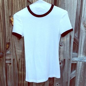 Urban Outfitters white cotton tee with black trim.